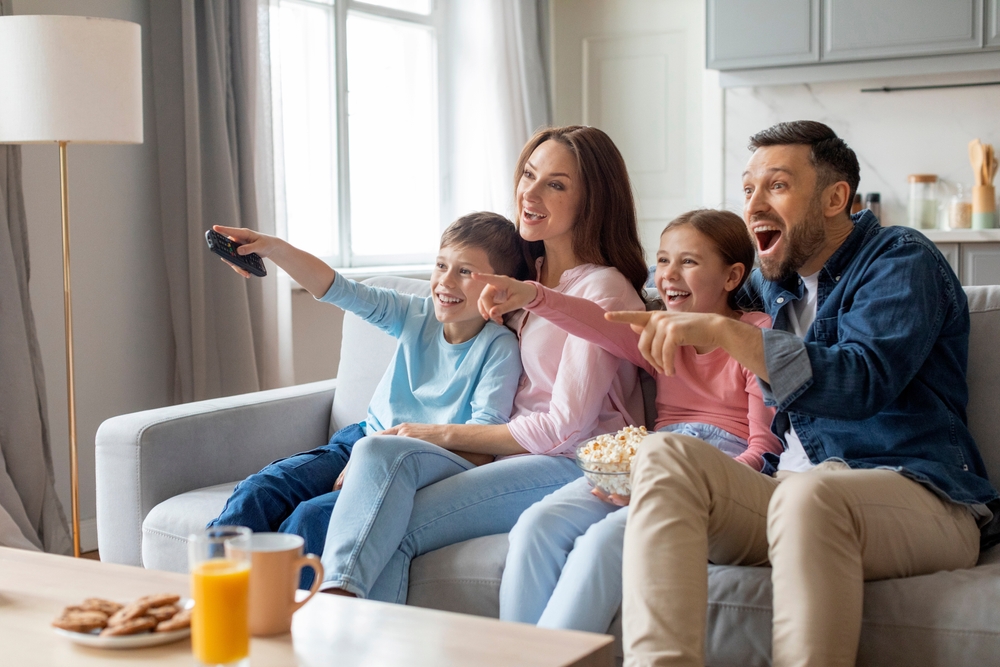 Family enjoying Armstrong TV on a large television